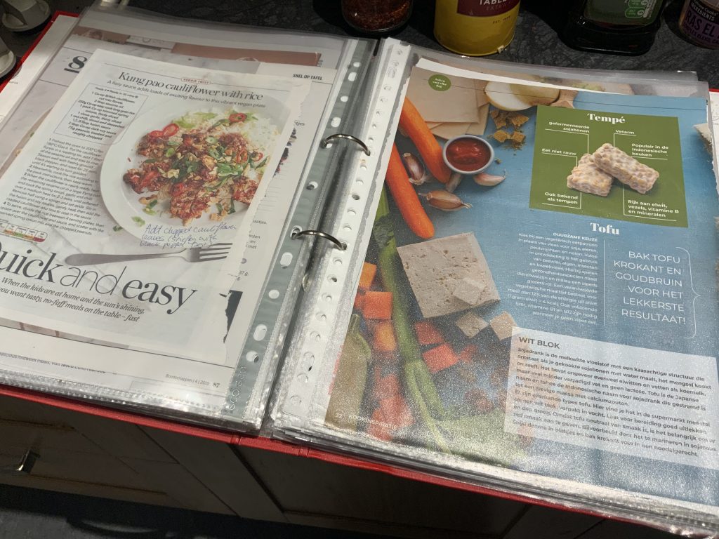Jennifer’s red folder filled with recipes, handwritten notes, and tips and tricks which have helped her plan her switch to a vegetarian diet.